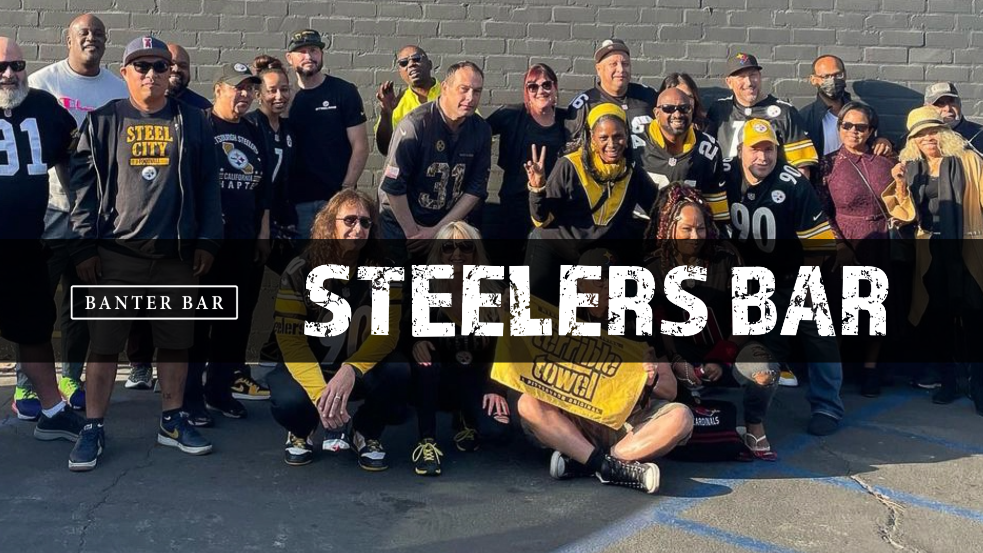 Crowd of Steelers fans stand behind Banter Bar West Los Angeles